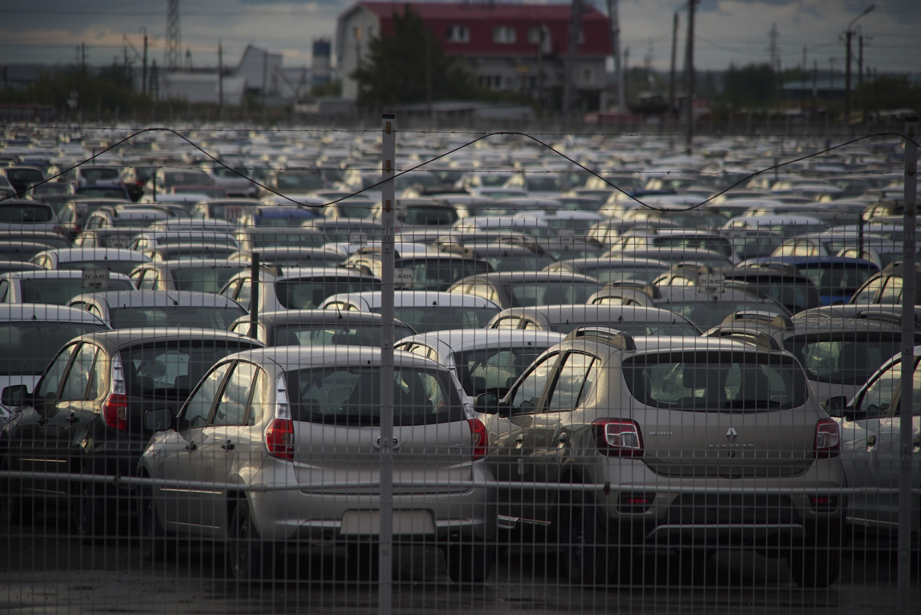 Imported cars parking in christian orthodox transfiguration church domes seen acroos the urban landscape of tolyatti samara oblast russia eurasia. 1 september 2016